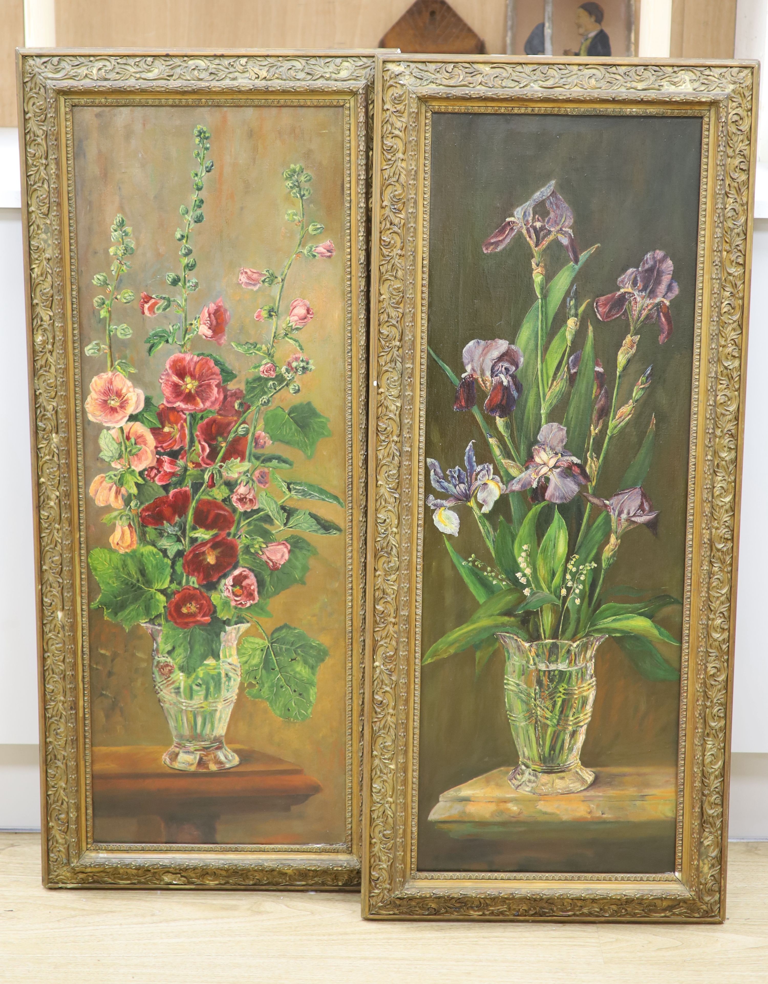 English School c.1900, pair of oils on canvas, Still lifes of irises and hollyhocks in vases, 94 x 32cm